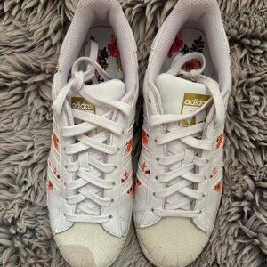 Adidas superstar with embroidered flowers